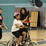 special needs child enjoying biking