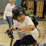 special needs child enjoying biking